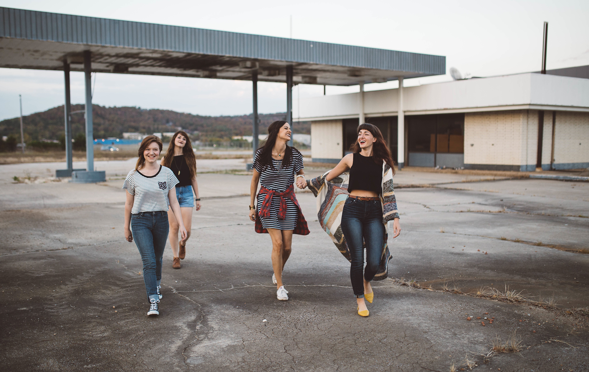 Group of Girls on an Urban Adventure, pictured at an abandoned gas station.