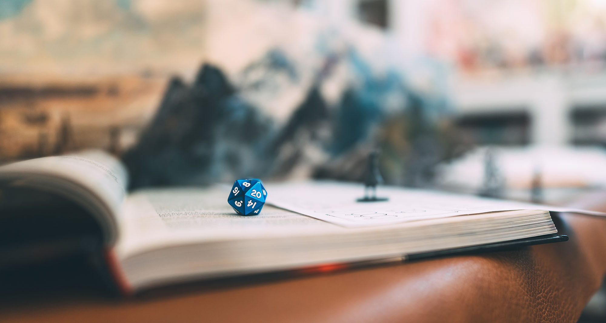 Blue D20 on a copy of the PHB