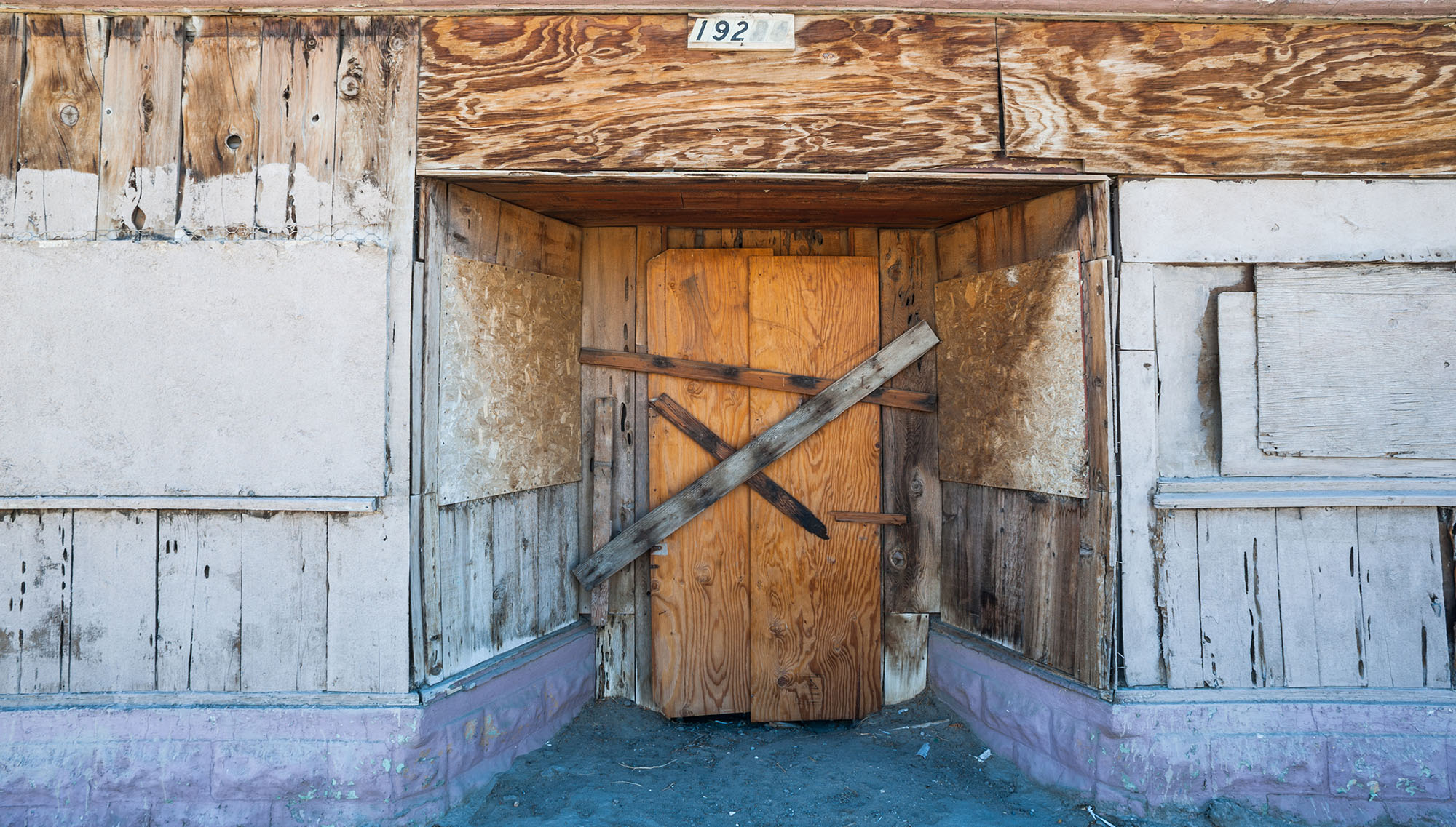 Boarded up building - photo by Gabriel Cassan